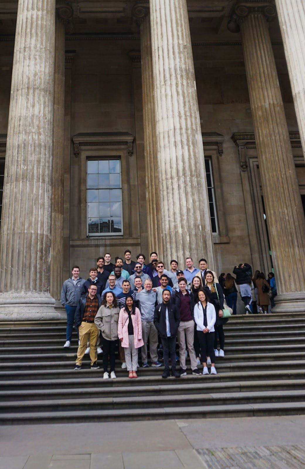 Allan Eberhart, senior associate dean of the MSF program, with a group of MSF students before their tour of the British Museum in London.
